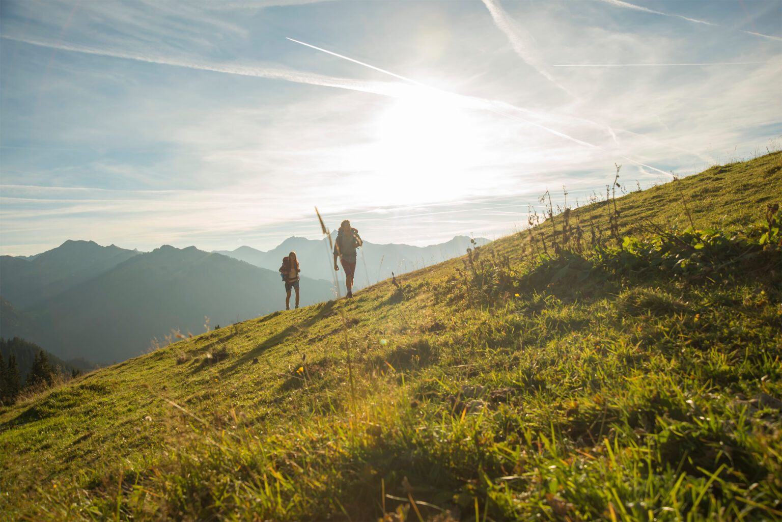 Young couple hiking in Tyrol along Via Romea Germanica